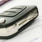 Car Key and Pen on Documents