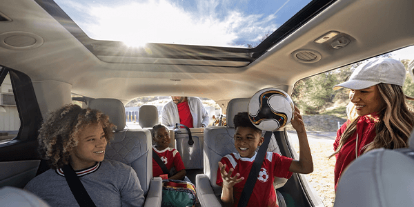 soccer family in a vehicle with a sunroof