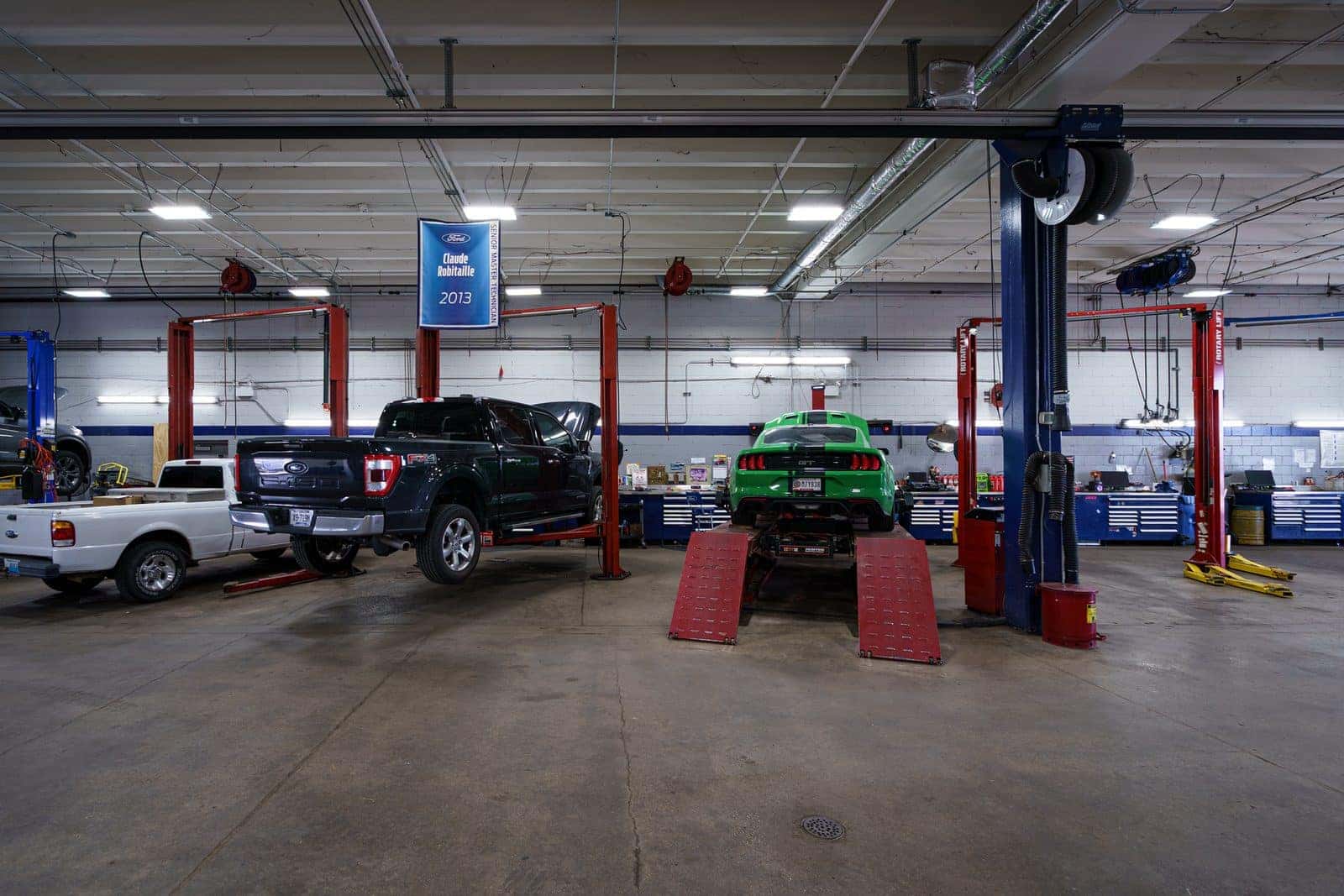 Ford vehicles being serviced inside the Bob Swope Ford service center