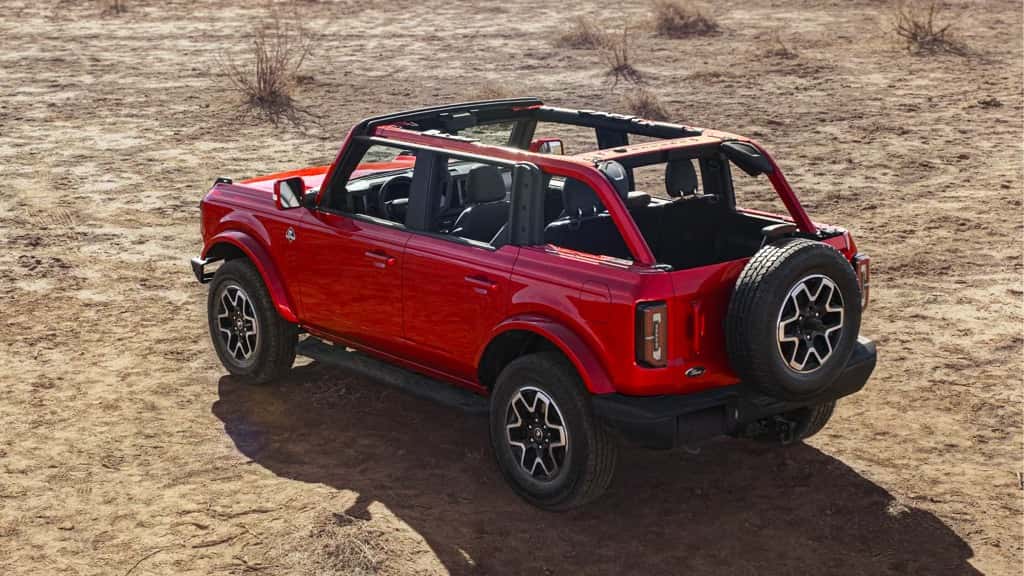 2023 Ford Bronco with the roof removed parked on a dirt road