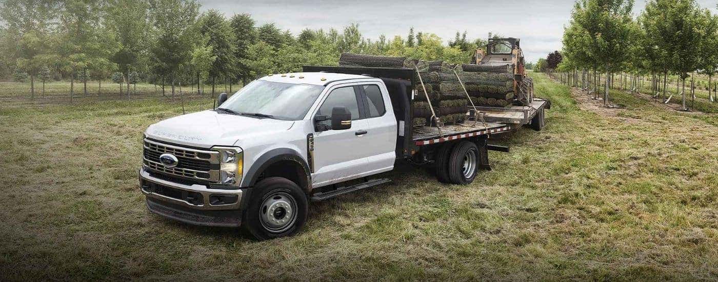 White 2025 Ford F-450 XLT Chassis Cab towing trailers with sid