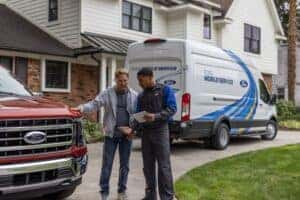 Mobile Service representative speaking with customer