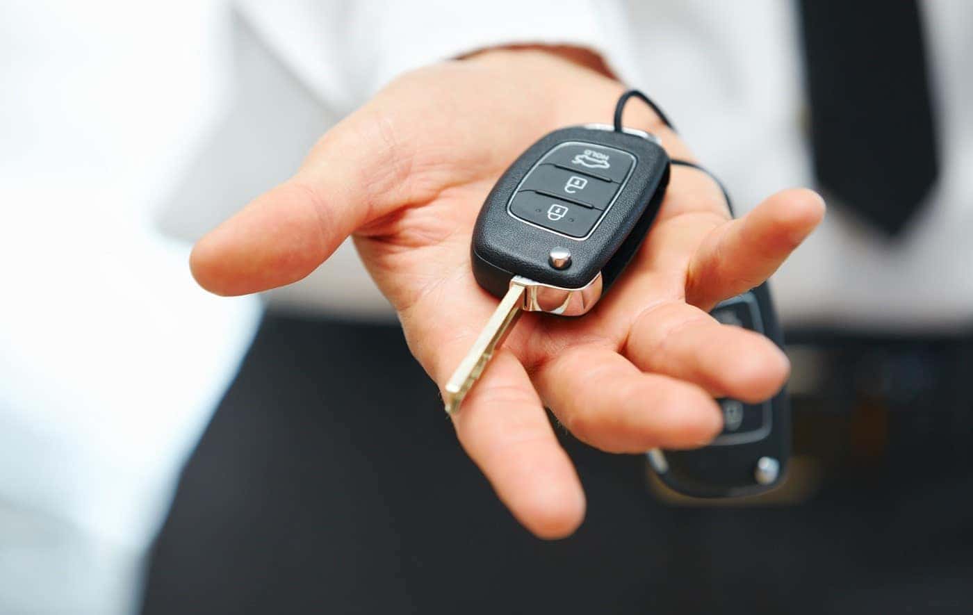 Car Salesman holding Car Keys