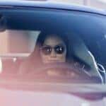 Woman driving Mustang