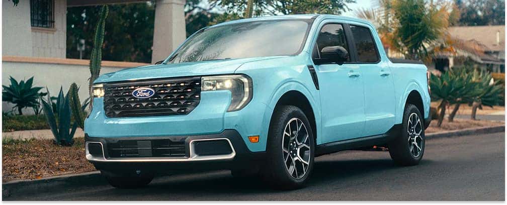 Front three-quarter view of a light blue 2026 Ford Maverick parked on a paved road.
