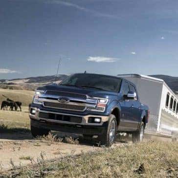 2019-Ford-F-150-Towing-a-Trailer-on-Dirt-Road