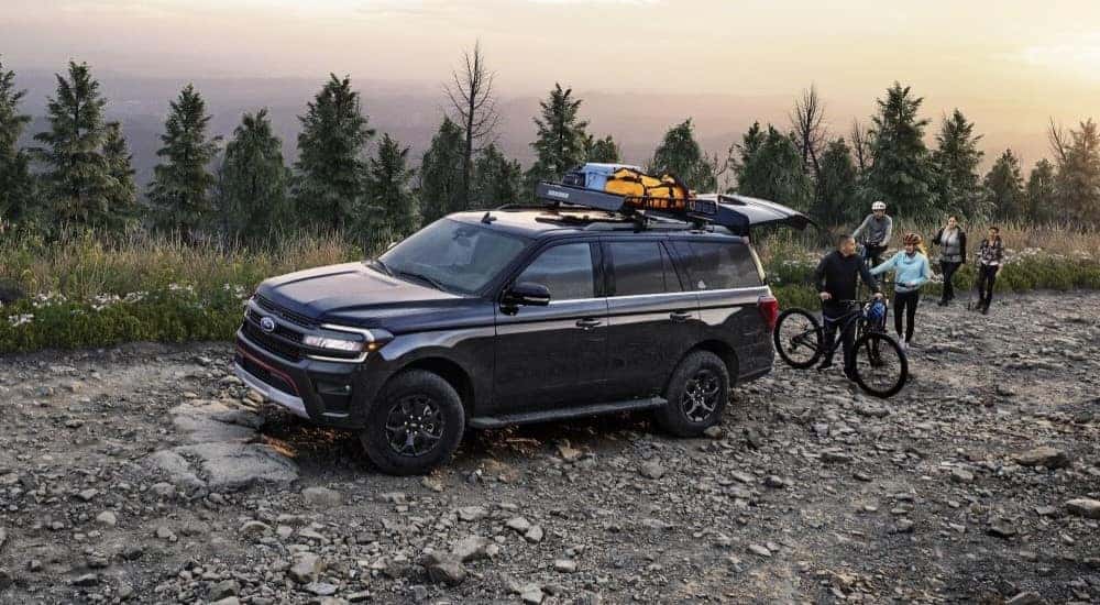 A black - 2023 Ford Expedition Timberline is shown on a rocky trail.