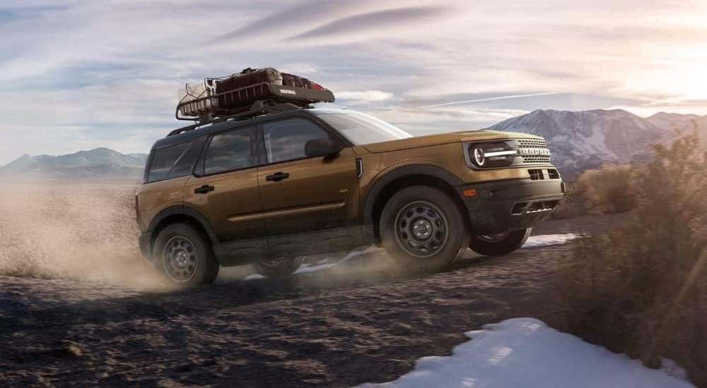 A bronze 2023 Ford Bronco Sport Badlands is shown off-roading.