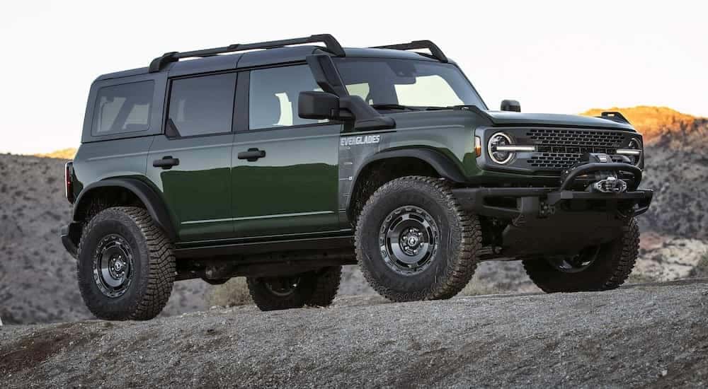 A green 2022 Ford Bronco Everglades is shown from the side after leaving a Ford Bronco dealer in Canon City.