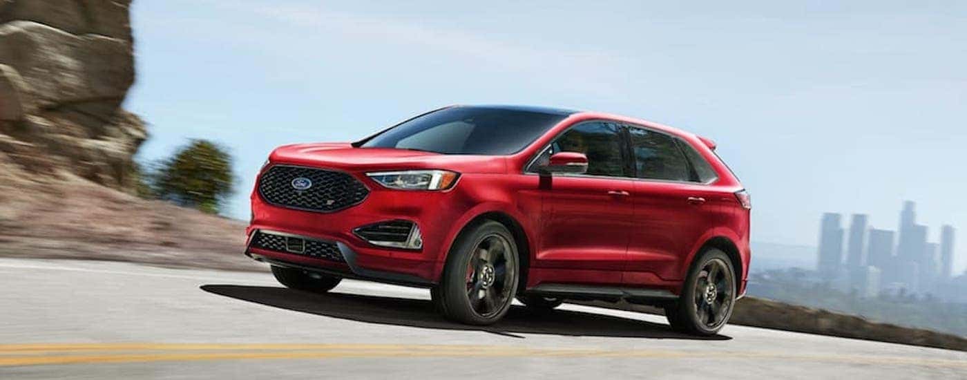 A red 2020 Ford Edge ST is shown from the side.
