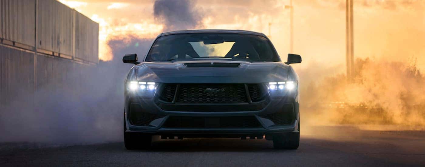 A grey 2024 Ford Mustang Gt is shown from the front after leaving a Ford dealer near Custer County.
