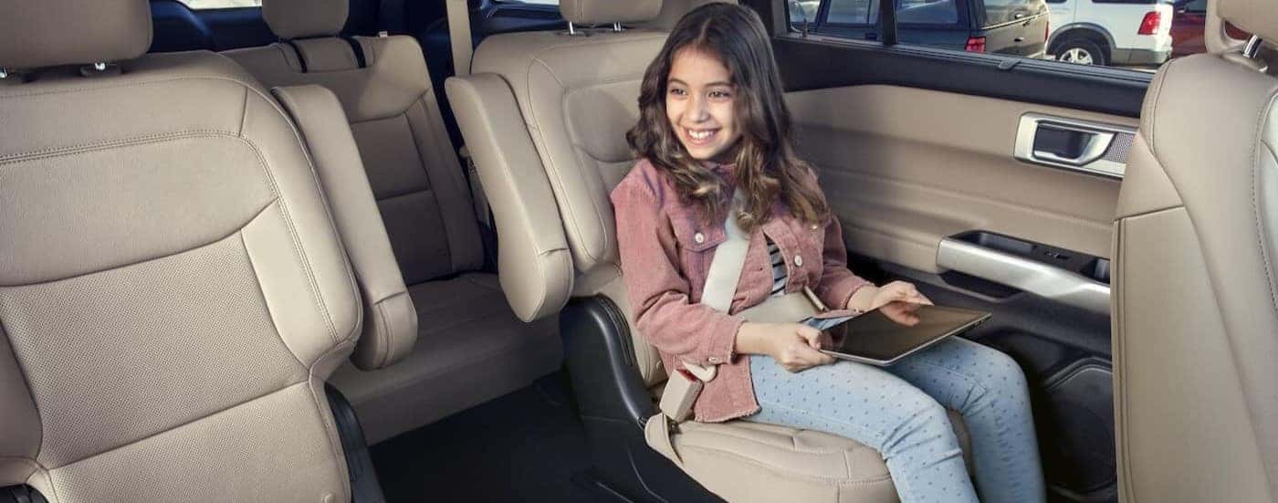 The tan and gray rear interior in a 2023 Ford Explorer for sale is shown.