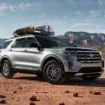 A popular Ford Explorer for sale, a silver 2025 Ford Explorer Active, is shown parked off-road.
