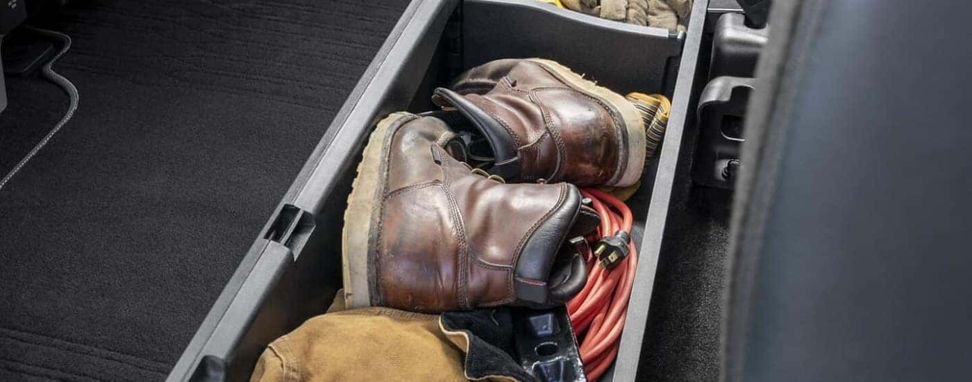 A pair of boots are shown in a 2022 Ford F-150 for sale near Colorado Springs.