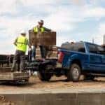 A blue 2020 Ford F-250 is shown from the rear at an angle.