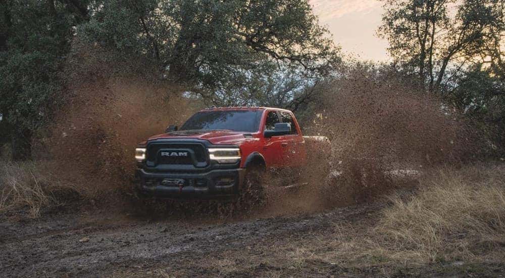 A red 2020 Ram 2500 Power Wagon is shown from the front at an angle after leaving a dealer that has used trucks for sale.