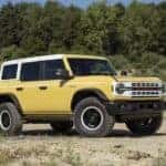 A yellow 2024 Ford Bronco Heritage Limited Edition is shown parked after viewing a Ford Bronco for sale near Colorado Springs.