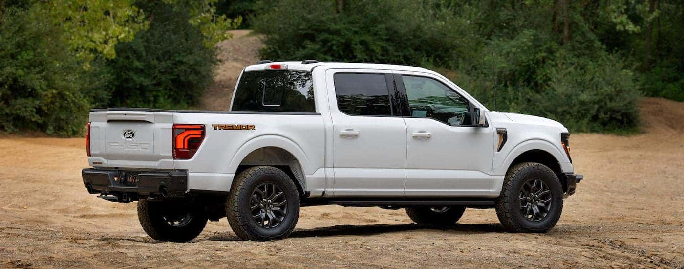 A white 2024 Ford F-150 Tremor is shown from the side.