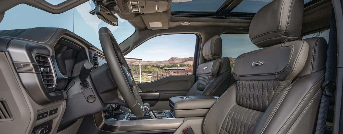 Side view of the front seats in the cabin of a 2024 Ford F-150 Platinum.