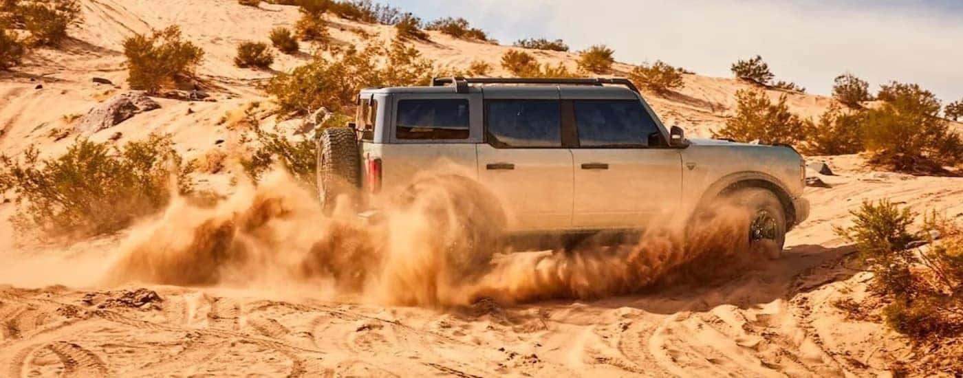 A silver 2025 Ford Bronco is shown from the side.