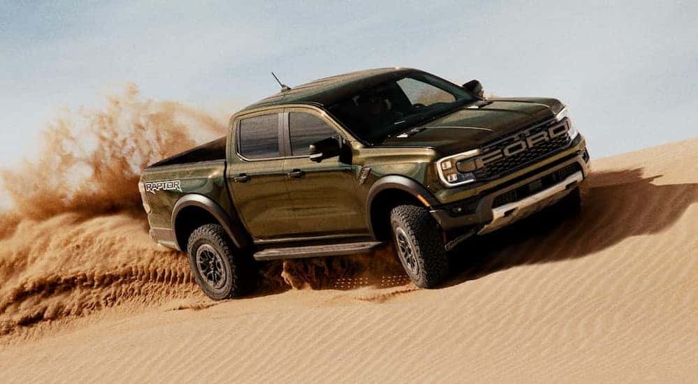 A green 2025 Ford Ranger is shown off-roading.