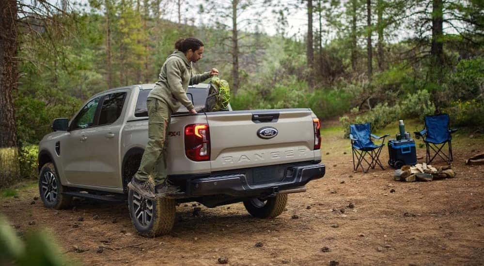 A tan 2025 Ford Ranger Fx4 is shown parked on a camp site.