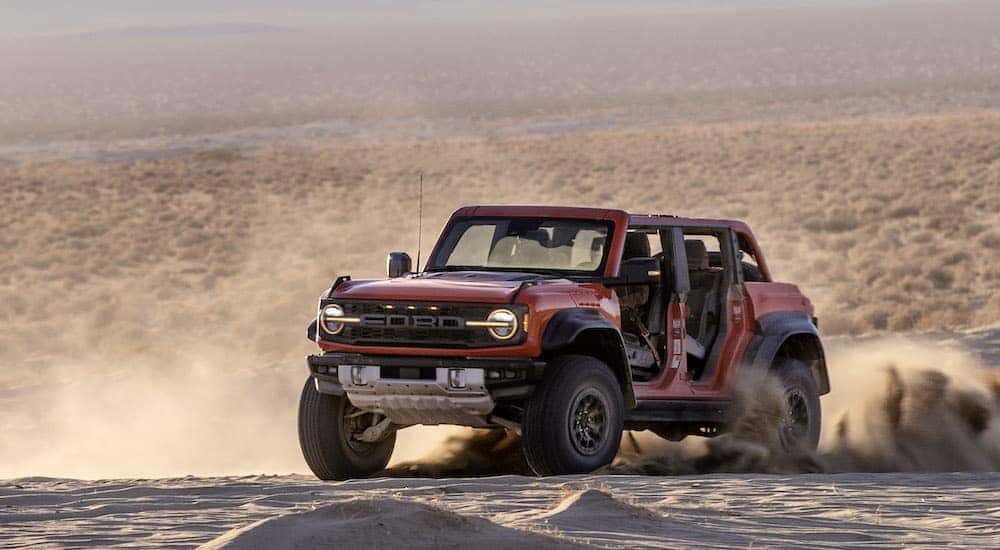 A red 2025 Ford Bronco Raptor from the front.