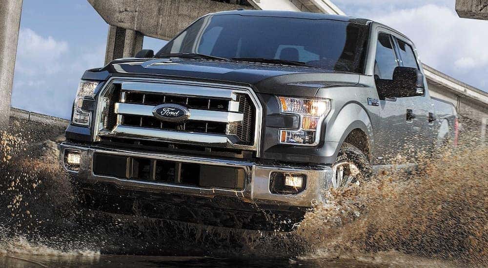A grey 2017 Ford F-150 from the front while off-road.
