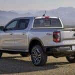 a silver 2024 Ford Ranger from the rear at an angle after leaving a dealer that has used cars for sale.