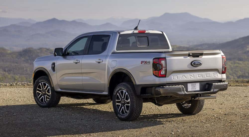 a silver 2024 Ford Ranger from the rear at an angle after leaving a dealer that has used cars for sale.