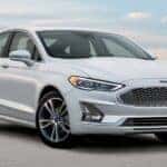 A white 2020 Ford Fusion parked after viewing used cars for sale near Pueblo West.