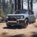 A blue 2025 Ford Bronco Sport off-roading.