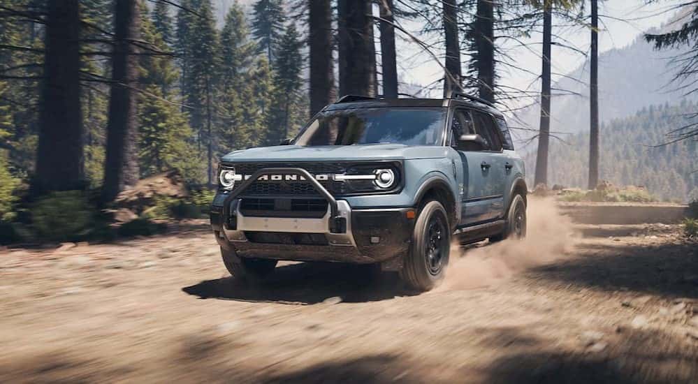 A blue 2025 Ford Bronco Sport off-roading.