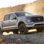 A silver 2021 Ford F-150 Tremor parked off-road.
