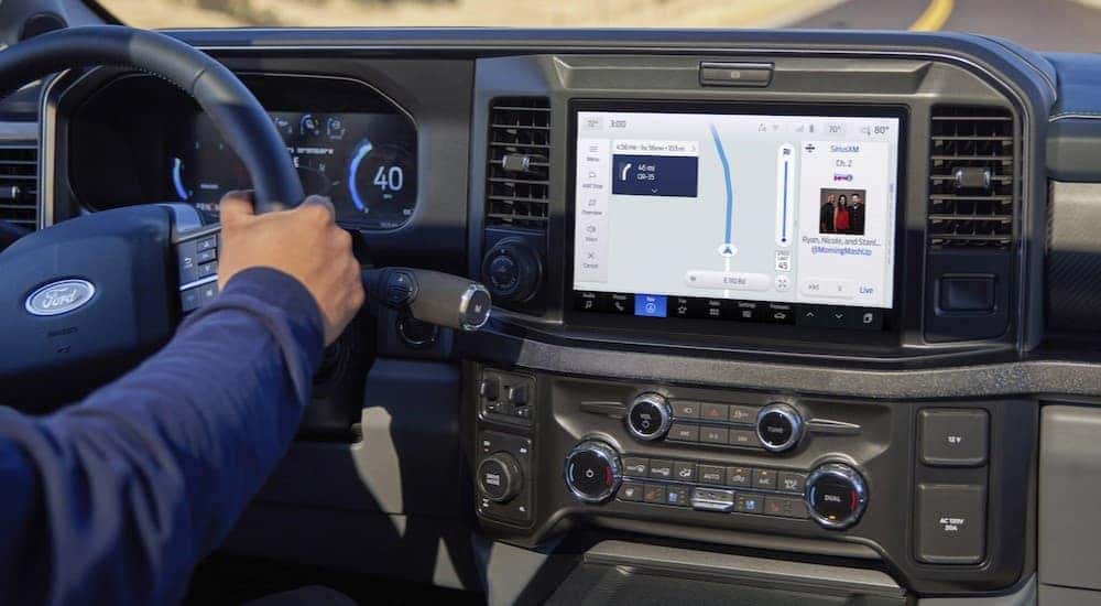 The black dash in a 2025 Ford F-250 at a Ford dealer near Florence.