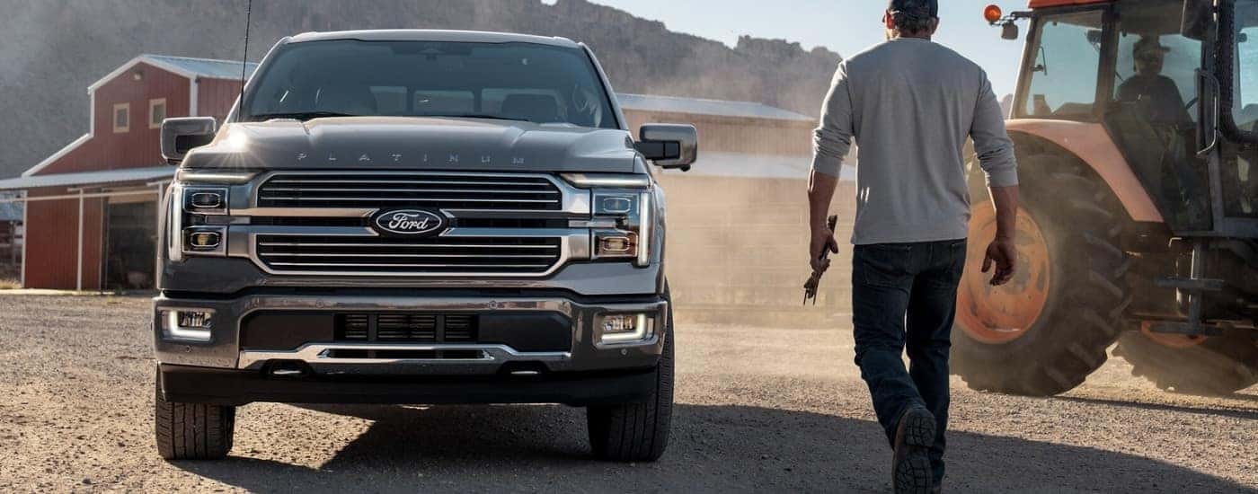 Grey 2025 Ford F-150 Platinum parked on a farm
