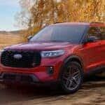 A red 2026 Ford Explorer parked on an autumn day.