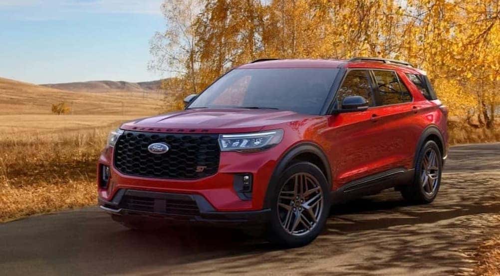 A red 2026 Ford Explorer parked on an autumn day.