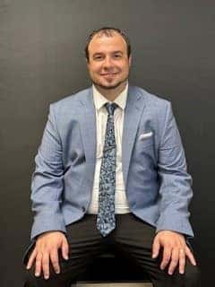 Purchasing director Andrew Montgomery is shown.