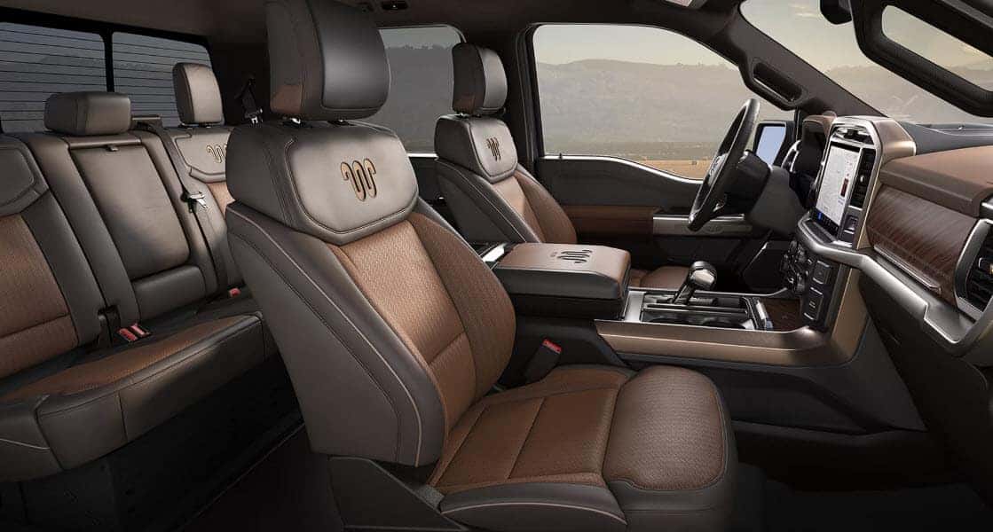 Premium leather interior of the 2026 Ford F-150 featuring King Ranch seats and digital dashboard