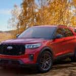 2026 Ford Explorer exterior red SUV on a fall road
