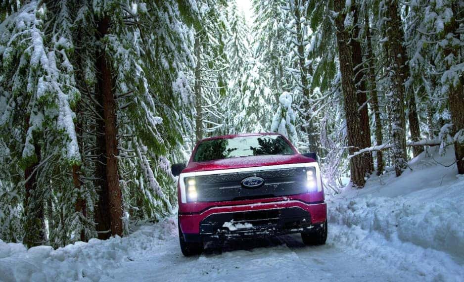 Ford vehicle driving through snowy winter conditions