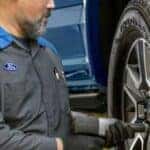 Ford technician installing winter tires at Greg Hubler Ford in Muncie IN