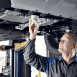 Certified Ford technician performing oil change service in Muncie IN