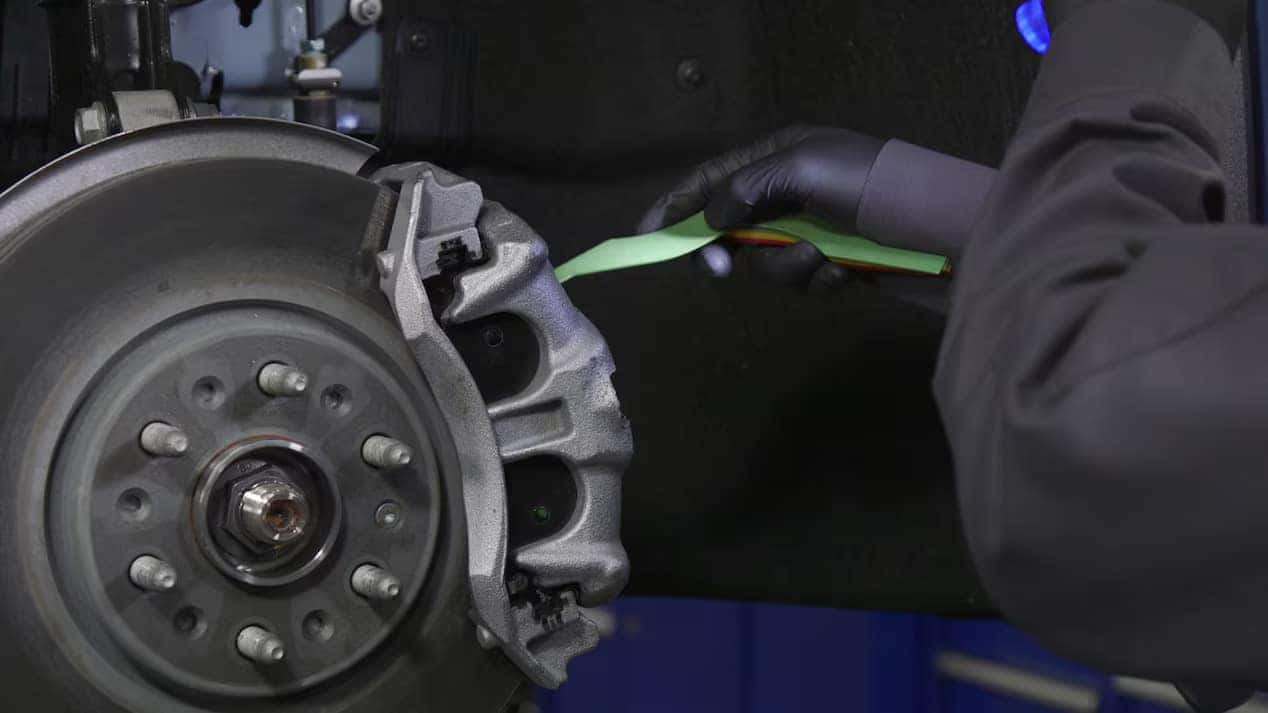 Ford certified technician inspecting braking hardware and severe duty components