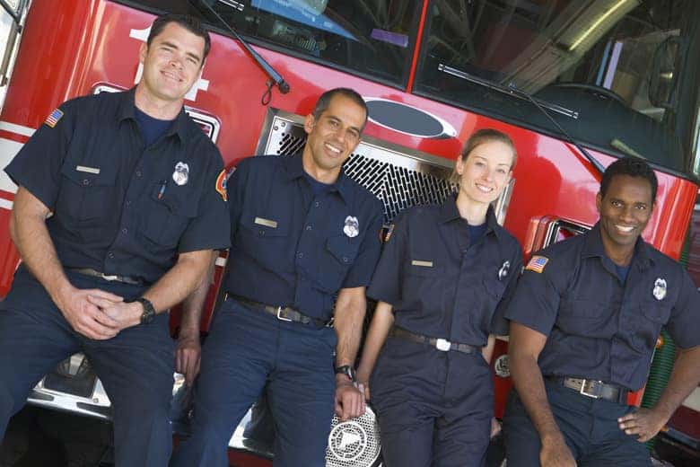 Fire Fighters standing in front of Truck