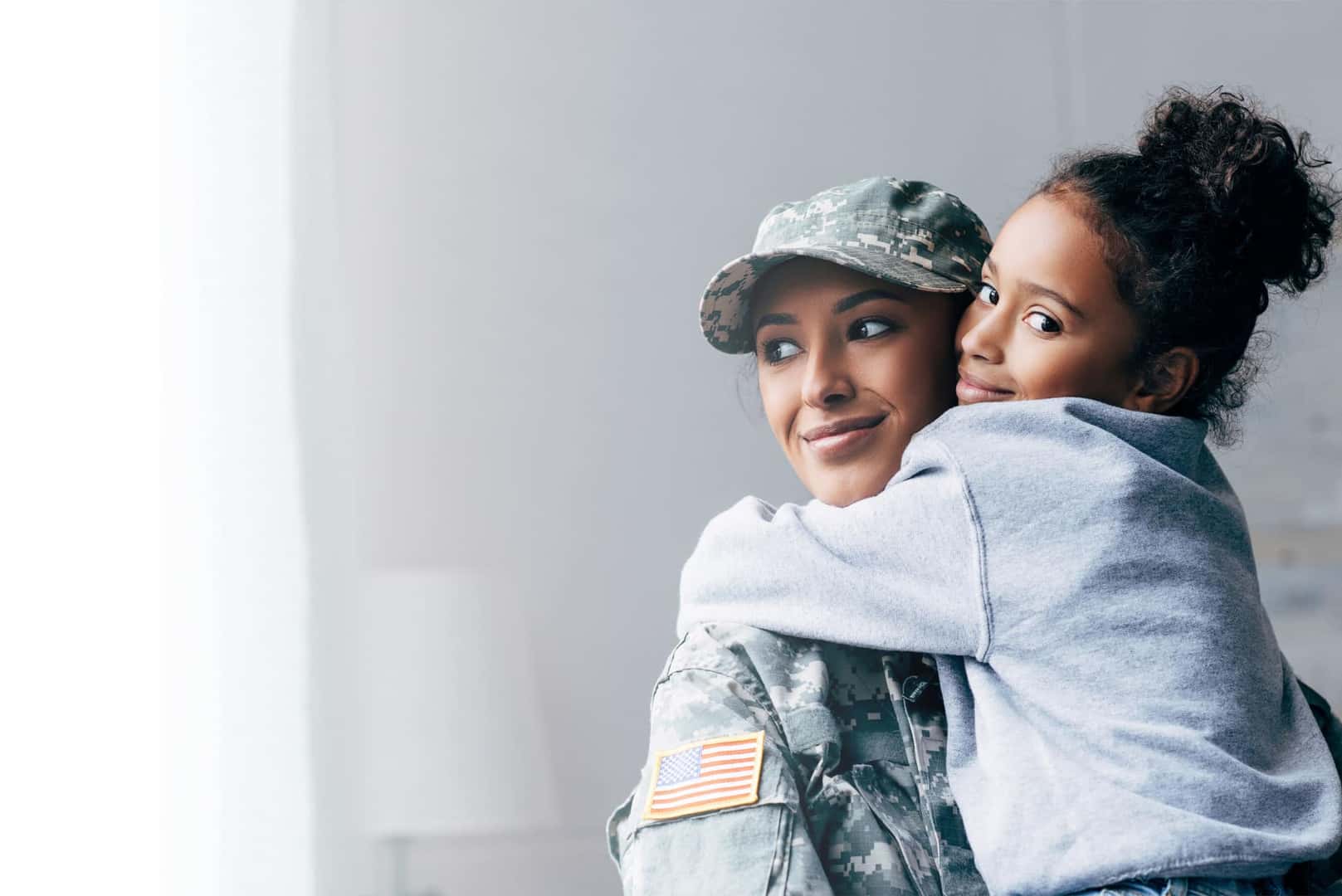 A soldier hugging her daughter