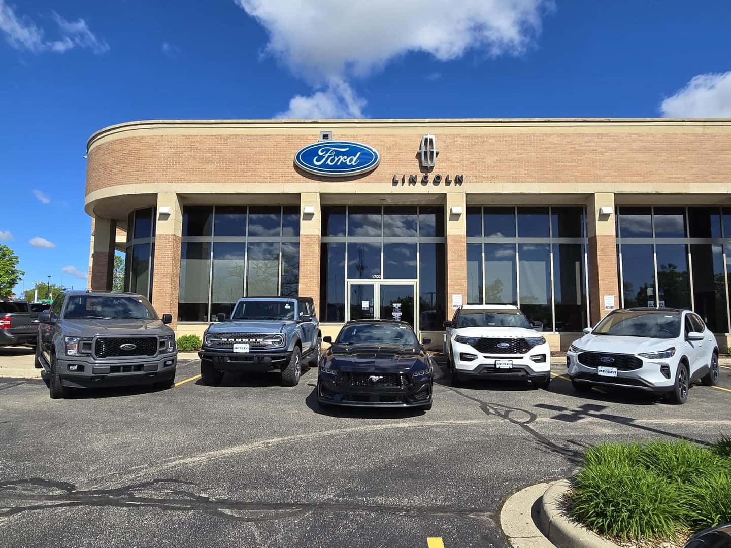 Front of Ford dealership at an angle.