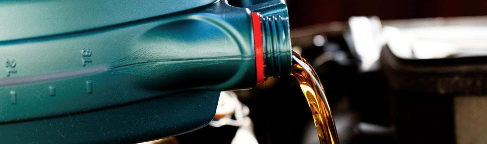 Motor oil being poured out of container