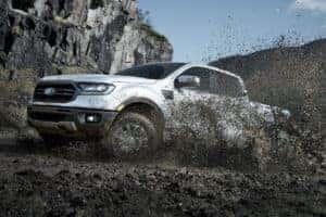 Ford Truck driving through Mud